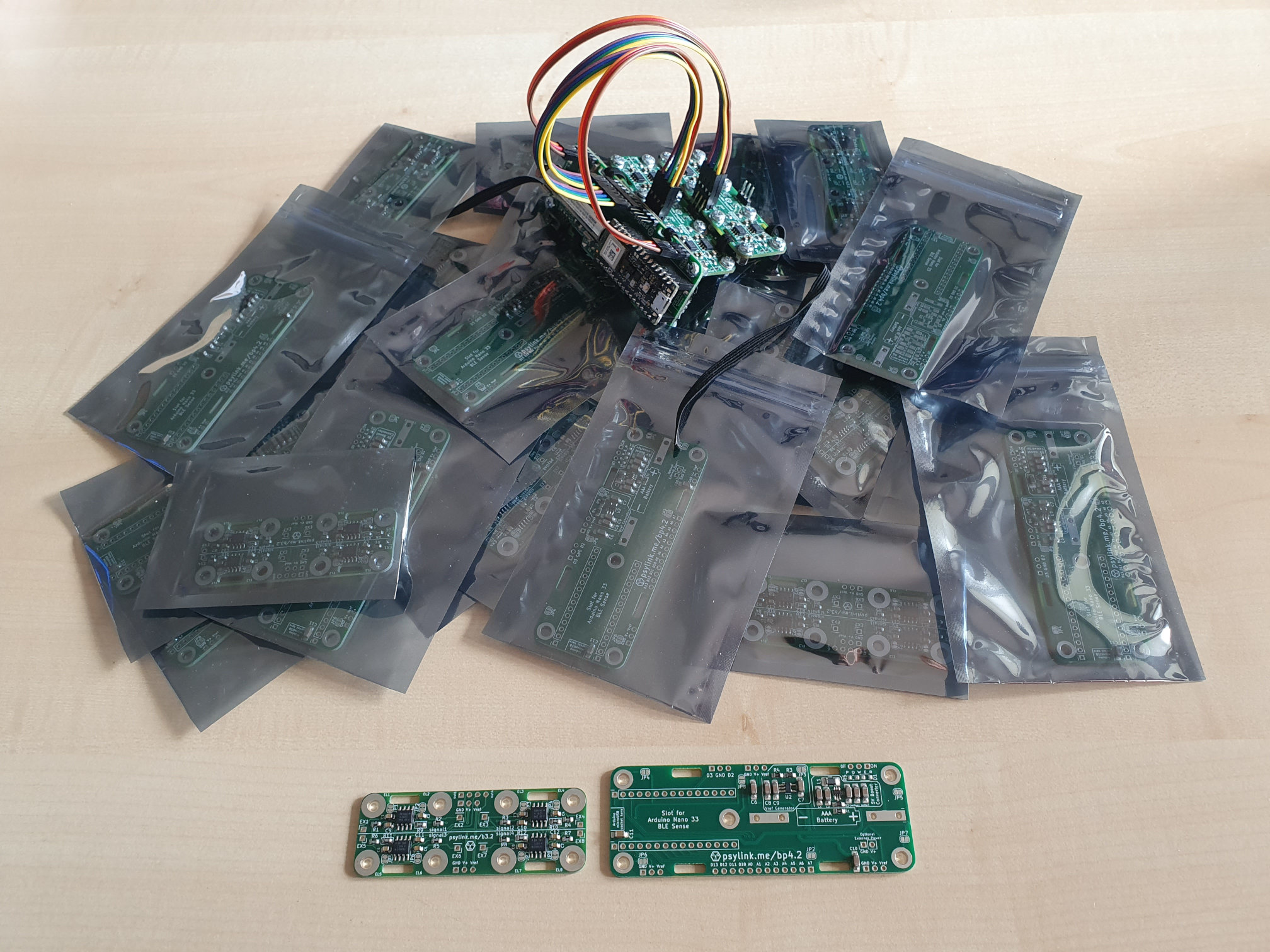Photo of a stack of plastic bags with PCBs